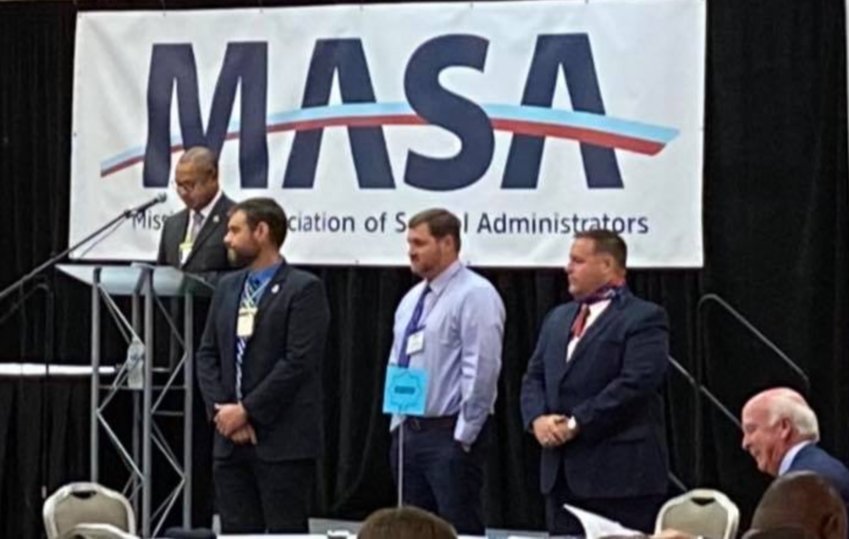 Dr. Lundy Brantley, standing far right, being sworn in as the Vice President of the Mississippi Association of School Administrators at the MASA Fall Leadership Conference.